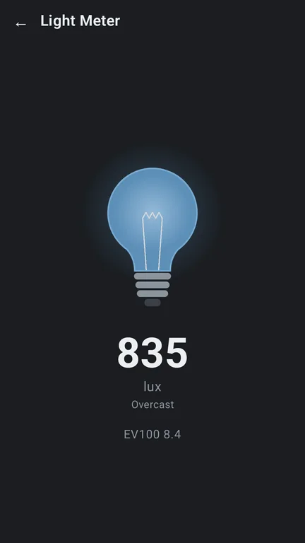 Bevel's Light Meter: a glowing bulb above the reading in lux, a label for the kind of light and an EV100 value.
